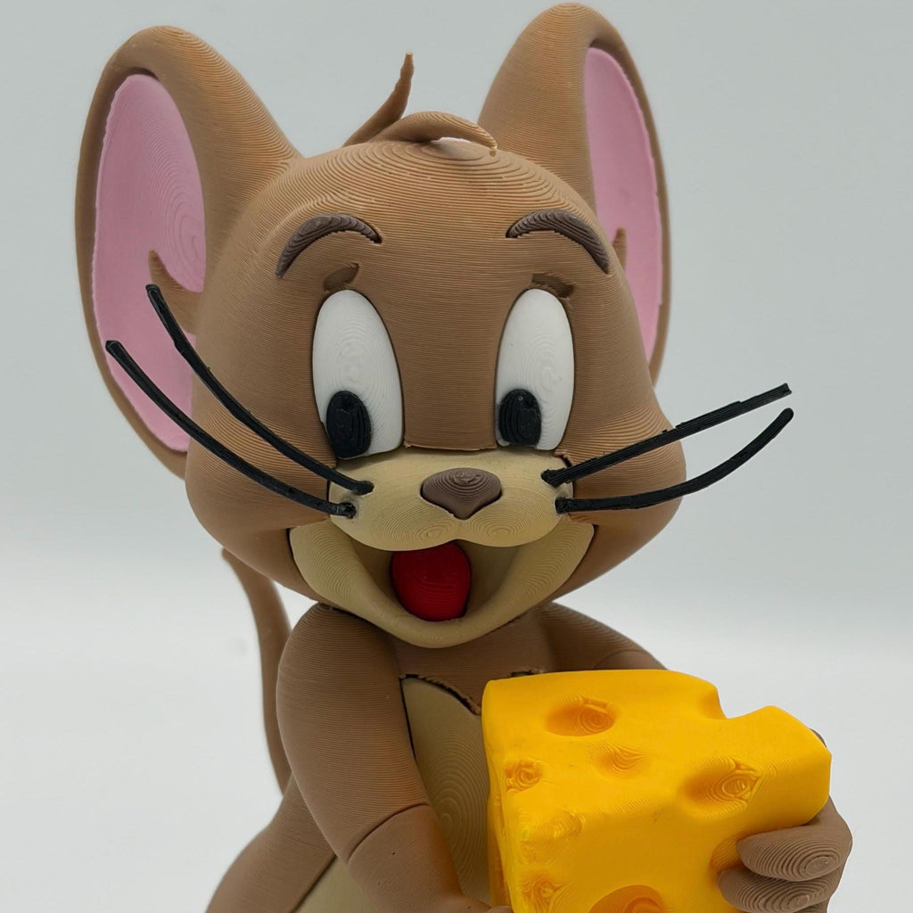 A 3D-printed figurine of Jerry the mouse from Tom and Jerry, holding a yellow cheese block, set against a plain light gray background.