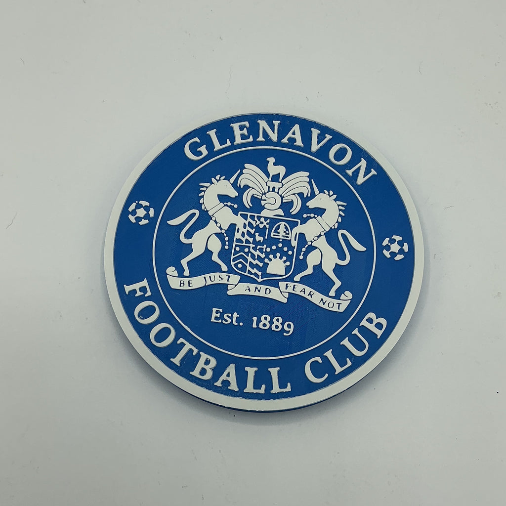 A circular blue and white Glenavon Football Club crest sticker or badge on a plain light grey background.